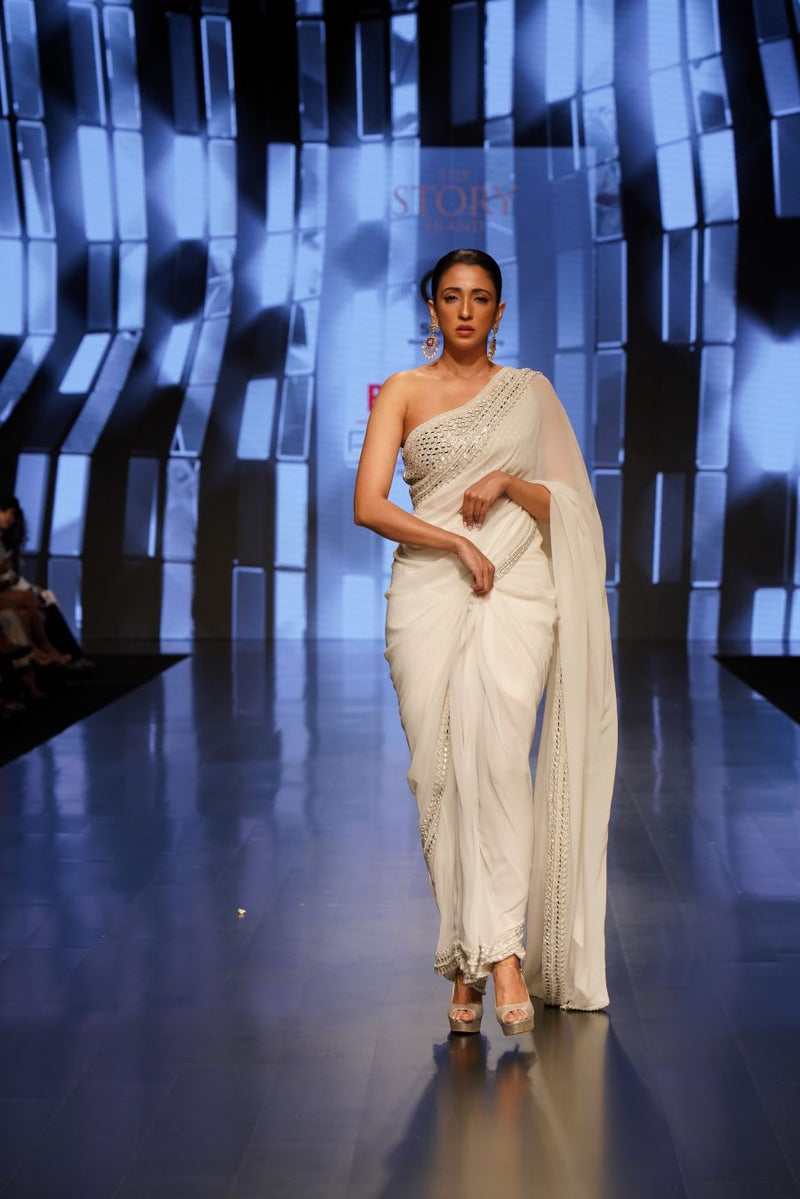 Mirror Embellished One Shoulder Blouse and an Ivory Saree with Mirrors