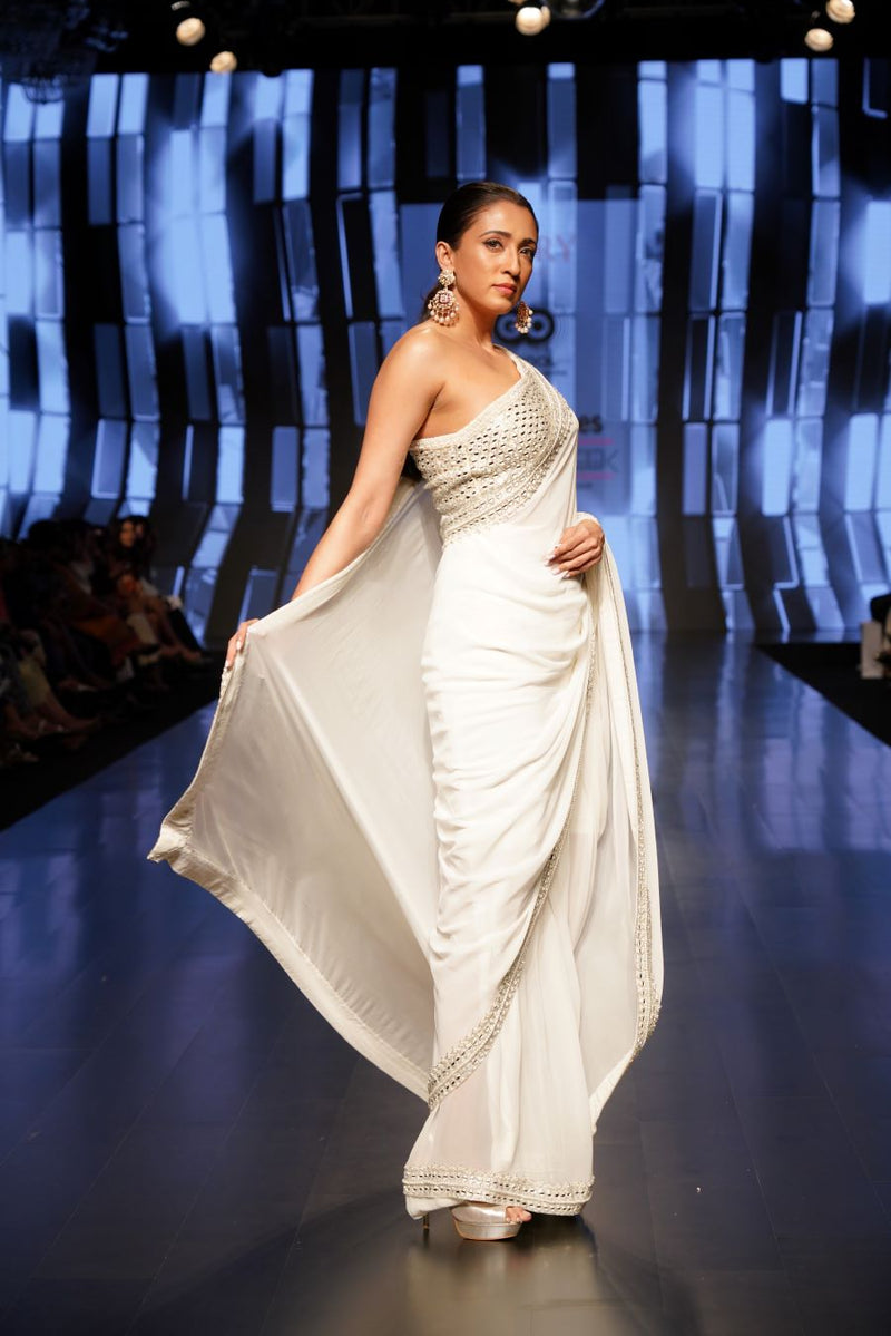 Mirror Embellished One Shoulder Blouse and an Ivory Saree with Mirrors